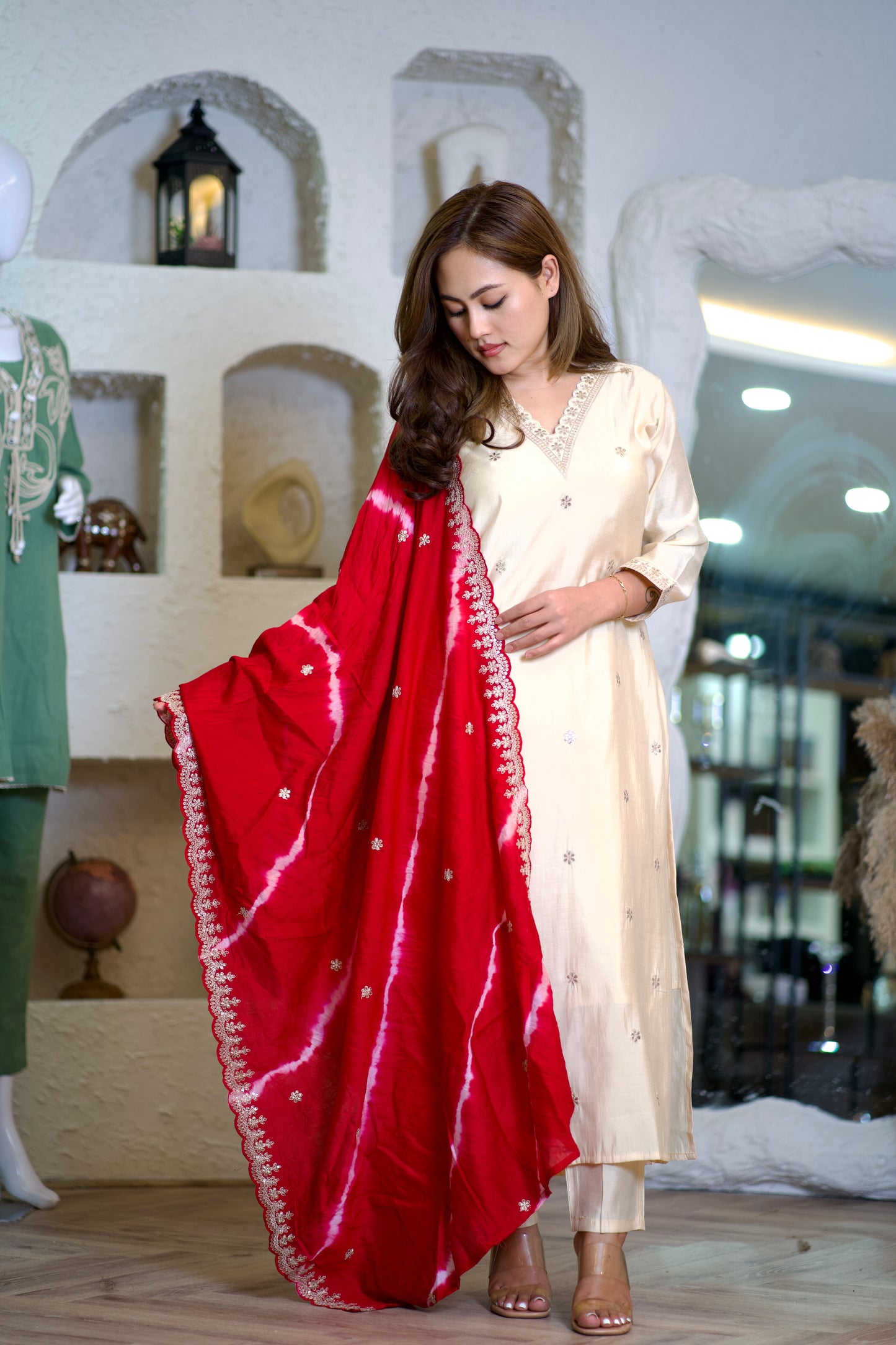 Lily cream colored suit with a vibrant red dupatta