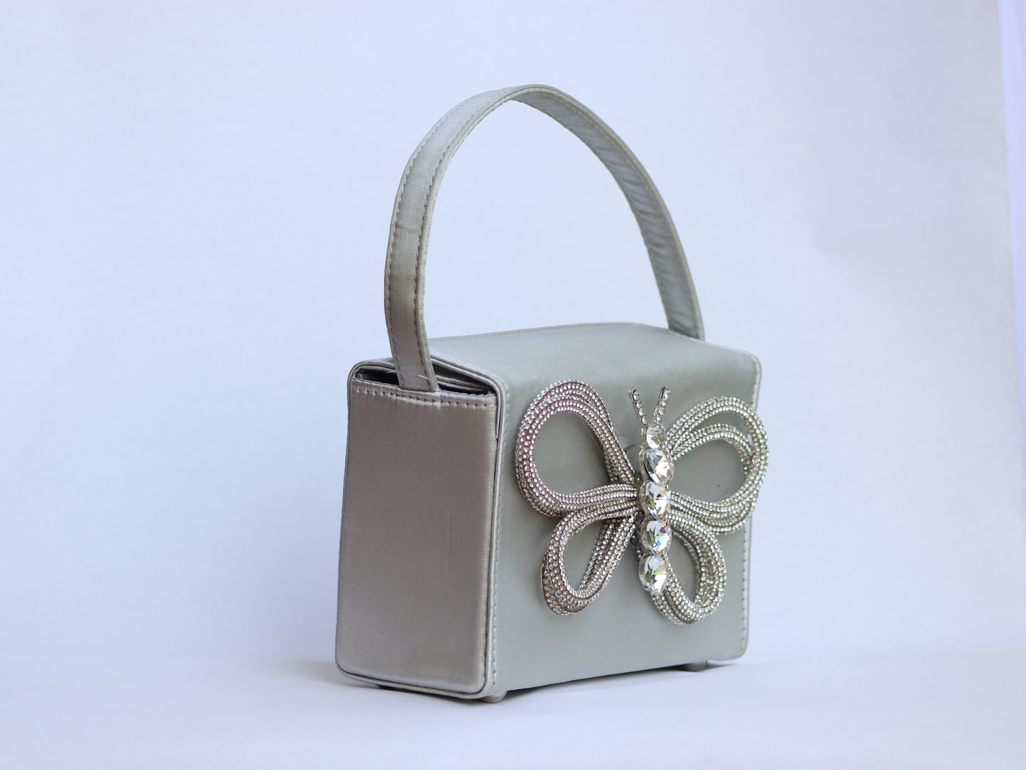 Lily white exterior adorned with a delicate butterfly design.