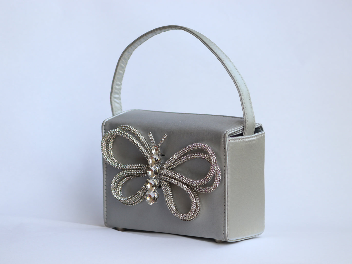 Lily white exterior adorned with a delicate butterfly design.