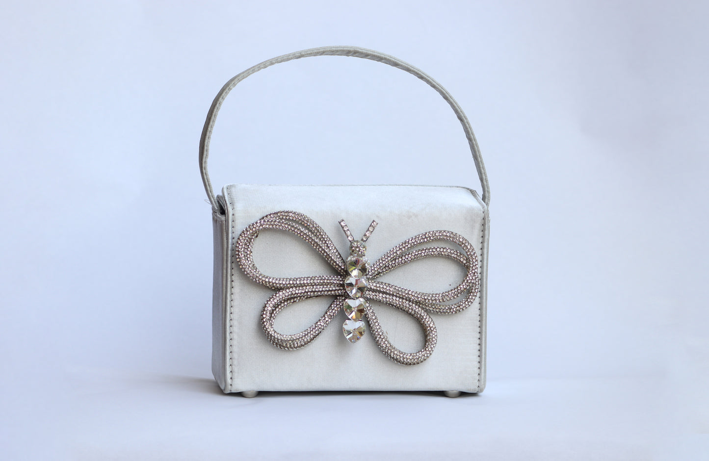 Lily white exterior adorned with a delicate butterfly design.